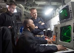 150618-N-DQ503-052 CELEBES SEA (June 18, 2015) – Ensign Robert Prine (left), from Dubuque, Iowa, Capt. Brian Finman, deputy chief of staff (right), from Appleton, Wis., and Chief Operations Specialist Kevin O. Griffith watch for incoming threats on a radar repeater during a FAC/FIAC exercise on board the forward-deployed amphibious assault ship USS Bonhomme Richard (LHD 6). Bonhomme Richard is the lead ship of the Bonhomme Richard Expeditionary Strike Group and is on patrol in the U.S. 7th Fleet area of responsibility. (U.S. Navy Photo by Mass Communication Specialist 3rd Class Taylor A. Elberg/Released)