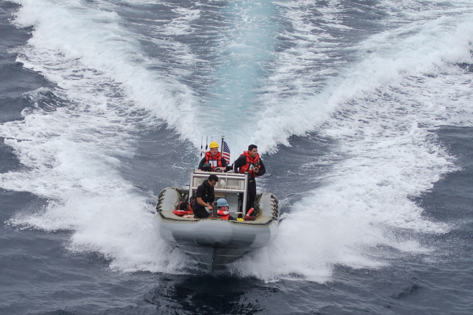 150619-N-ZZ999-003 CELEBES SEA (June 19, 2015) The crew of a rigid hull inflatable boat from the amphibious transport dock ship USS Green Bay (LPD 20) rescues Indonesians who were trapped on a raft at sea. Green Bay is assigned to the Bonhomme Richard Expeditionary Strike Group and is on patrol in the U.S. 7th Fleet area of operations. (Official U.S. Navy photo/Released)