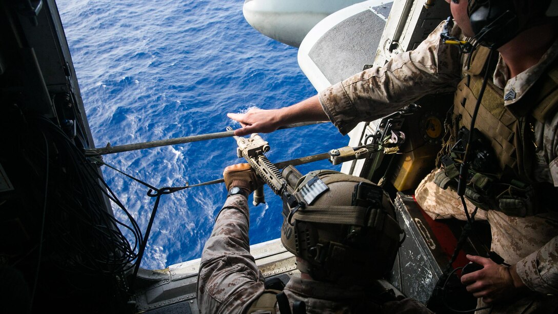 U.S. Marines with the 15th Marine Expeditionary Unit’s Maritime Raid Force practice aerial sniping from a CH-53E Super Stallion. The Marines practiced shooting at floating targets in order to improve their marksmanship and become comfortable firing from the air. The 15th MEU is embarked on the Essex Amphibious Ready Group and deployed to maintain regional security in the U.S. 5th Fleet area of operations. 