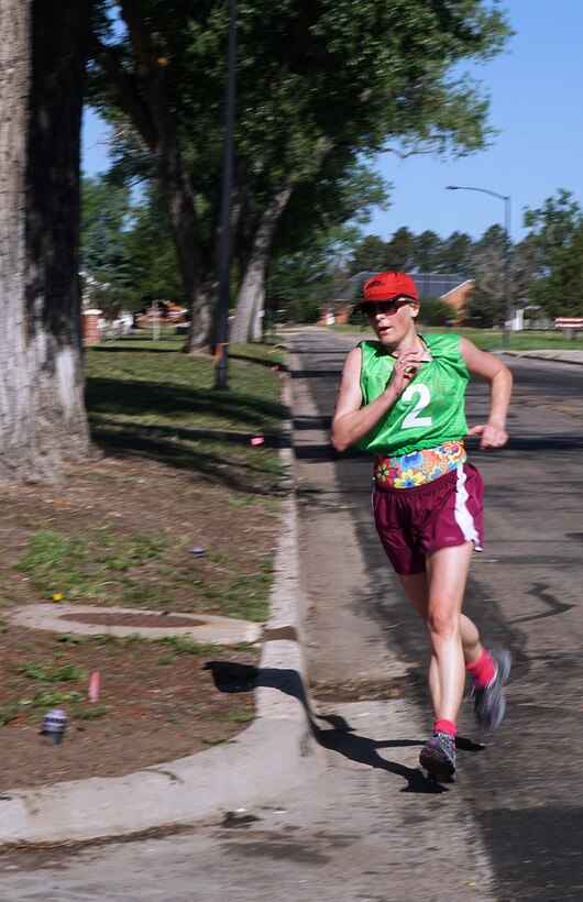 Lisa Spillman rounds the final corner of the 5-kilometer portion of the 90th Force Support Squadron mini-triathlon June 20, 2015, on F.E. Warren Air Force Base, Wyo. (U.S. Air Force photo by Airman 1st Class Brandon Valle)