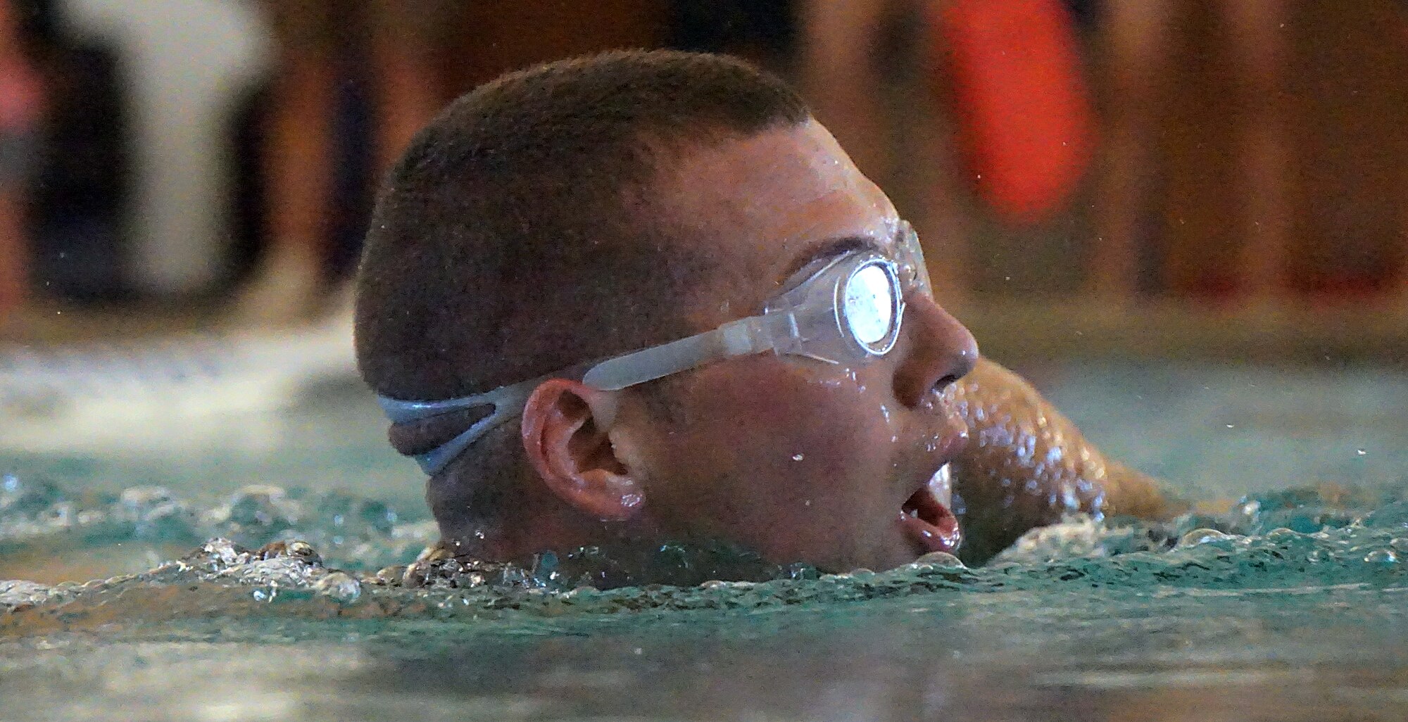 Aaron Smela takes a breath as he swims 500 meters during the 90th Force Support Squadron mini-triathlon June 20, 2015. The swim was the first of three events which took participants across F.E. Warren Air Force Base, Wyo. (U.S. Air Force photo by Airman 1st Class Brandon Valle)