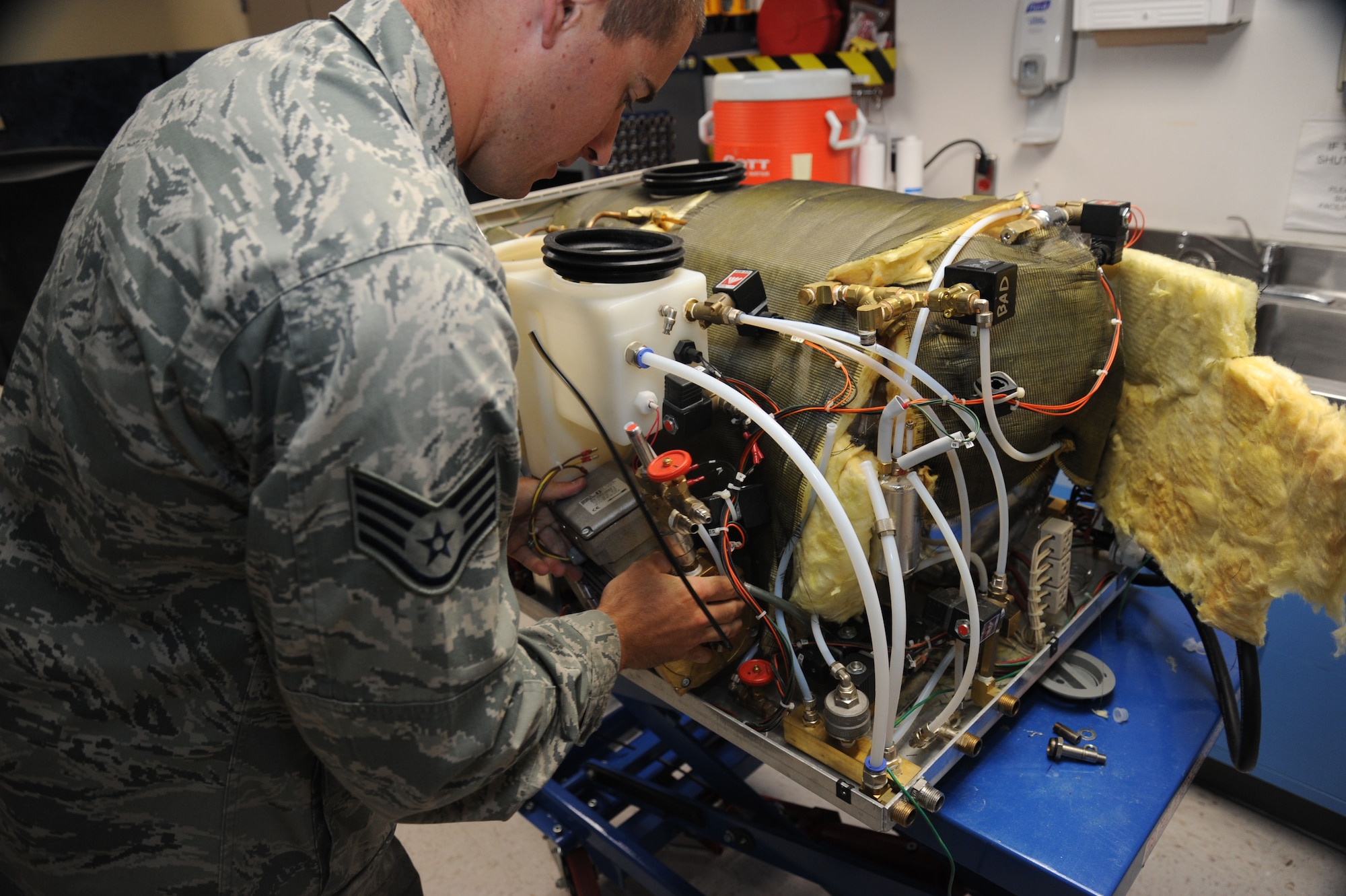 Staff Sgt. Logan Kendrick, 92nd Medical Support Squadron medical maintenance NCO in charge, reinstalls a component of the office’s test dental sterilizer June 18, 2015, at Fairchild Air Force Base, Wash. The medical maintenance office carries a good degree of creative freedom relative to other Air Force offices because of their lack of Technical Orders. (U.S. Air Force photo/Senior Airman Sam Fogleman)