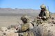 Master Sgt. Jared Pietras, left, U.S. Air Force Weapons School, joint terminal attack controller advanced course instructor and Tech. Sgt. James Larsen, JTAC, advanced instructor course, student pass target coordinates to an AH-64D Apache helicopters on the Nevada Test and Training Range, Oct. 9, 2014.    The USAFWS teaches graduate-level instructor courses that provide the world's most advanced training in weapons and tactics employment. (U.S. Air Force photo by Susan Garcia) 

