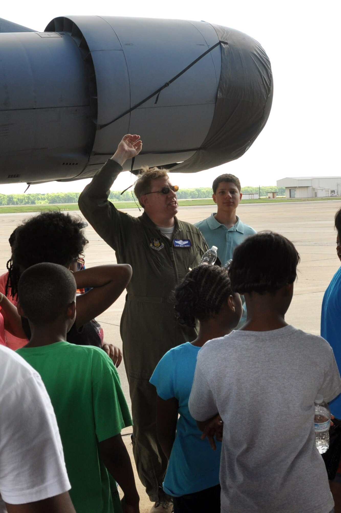 U.S. Air Force Lt. Col. Kenneth Wyzywany, 307th Operations Group, gives a tour of the B-52 Stratafortress to participants of the Central Tri Community Youth Program in Minden, La. on Barksdale Air Force Base, La., June 12, 2015. The youths were given the opportunity to ask questions about the different areas of the aircraft and were able to tour the interior of the B-52. (U.S. Air Force photo by Master Sgt. Laura Siebert/Released)