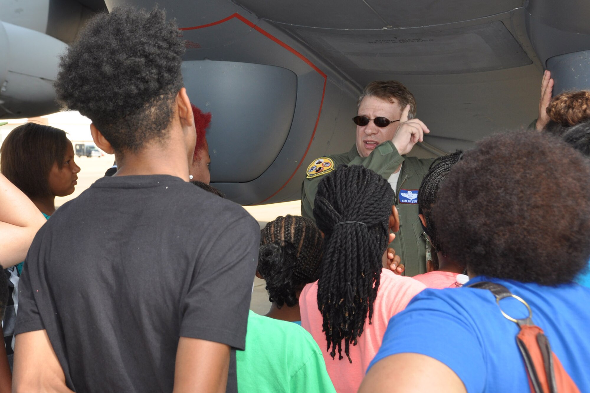 U.S. Air Force Lt. Col. Kenneth Wyzywany, 307th Operations Group, points out features of the B-52 Stratafortress to participants of the Central Tri Community Youth Program of Minden, La. on Barksdale Air Force Base, La., June 12, 2015. The youth group received an in-depth tour of the B-52 and the aircraft of the Barksdale Global Power Museum. (U.S. Air Force photo by Master Sgt. Laura Siebert/Released)