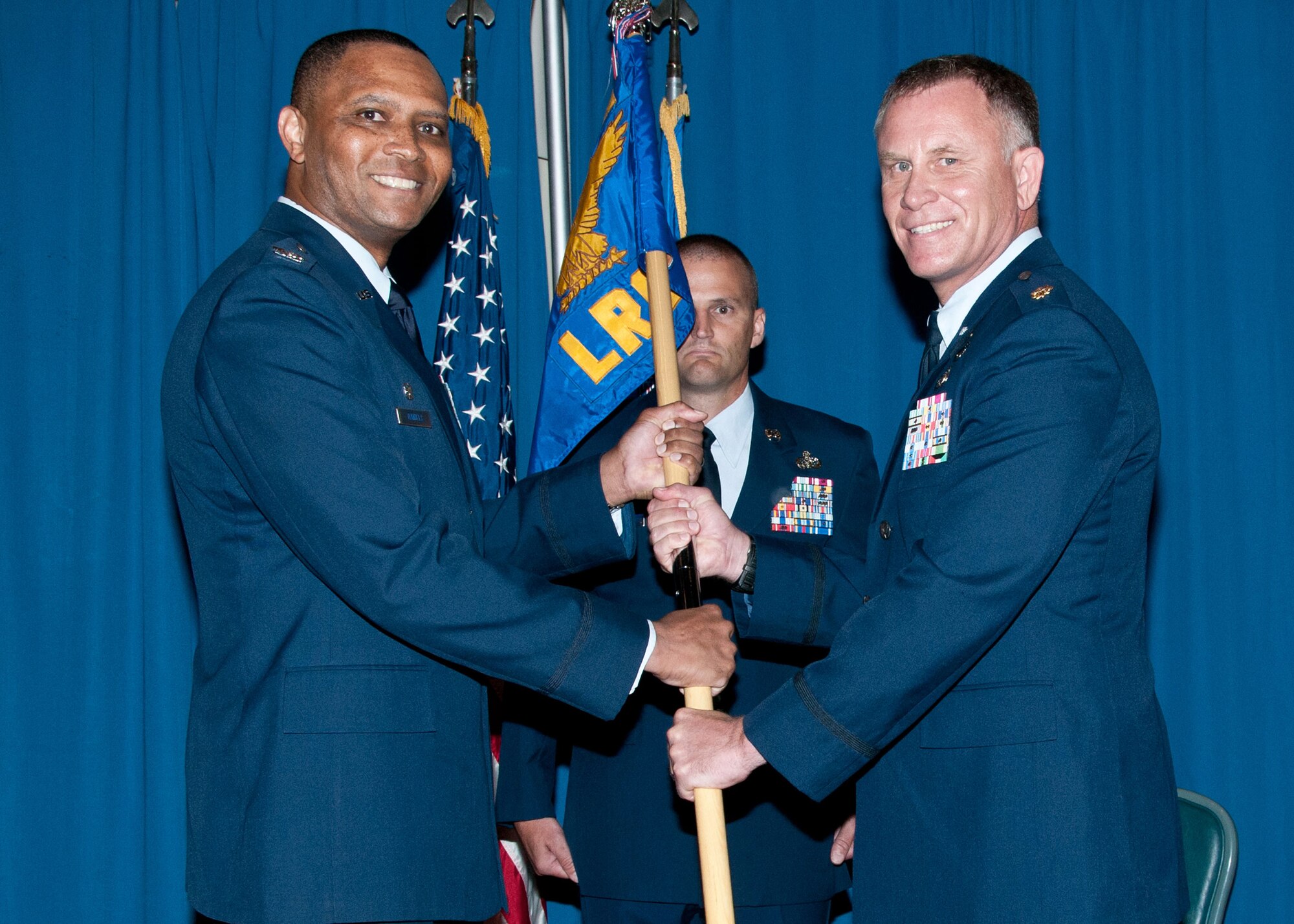 Maj. Shannon Caleb receives the 71st Logistics Readiness Squadron guidon from Col. Christopher Daniels, the 71st Mission Support Group commander, during a change of command ceremony at Vance Air Force Base, Oklahoma, June 22. Caleb relieved Maj. John Klohr during the morning ceremony. (U.S. Air Force photo / Terry Wasson) 