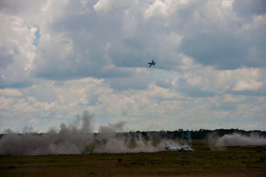 An A-10C Thunderbolt II performs a strafe run after target confirmation from joint terminal attack controllers (JTACs) during Exercise DRAGON STRIKE June 9, 2015, at Avon Park Air Force Range, Fla. The 93d Air Ground Operations Wing JTACs performed close air support coordination during the eight-day exercise. (U.S. Air Force photo by Airman 1st Class Dillian Bamman/Released)