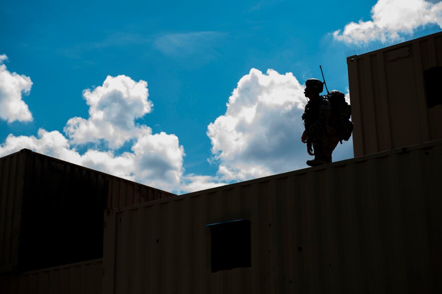 A joint terminal attack controller (JTAC) from the 18th Air Support Operations Group surveys the area after calling in an A-10C Thunderbolt II strafe run during Exercise DRAGON STRIKE June 9, 2015, at Avon Park Air Force Range, Fla. The A-10 pilots performed a strafe run by firing 50-caliber rounds at targets confirmed by the JTAC. (U.S. Air Force photo by Airman 1st Class Dillian Bamman/Released)