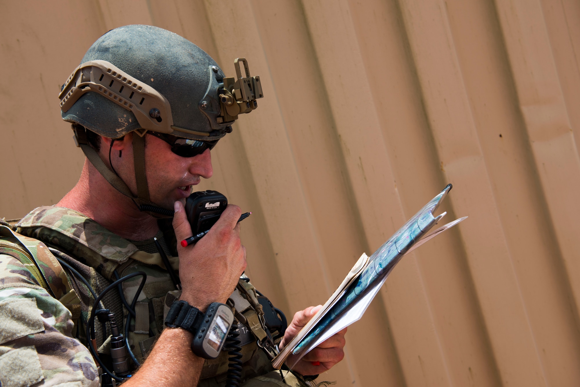 U.S. Air Force Staff Sgt. Robert Cooch, 18th Air Support Operations Group joint terminal attack controller (JTAC), delivers attack coordinates to B-52 Bomber pilots during Exercise DRAGON STRIKE June 9, 2015, at Avon Park Air Force Range, Fla. The B-52 and 75th Fighter Squadron’s A-10C Thunderbolt IIs coordinated with the JTACs to deliver close air support for the JTACs. (U.S. Air Force photo by Airman 1st Class Dillian Bamman/Released)