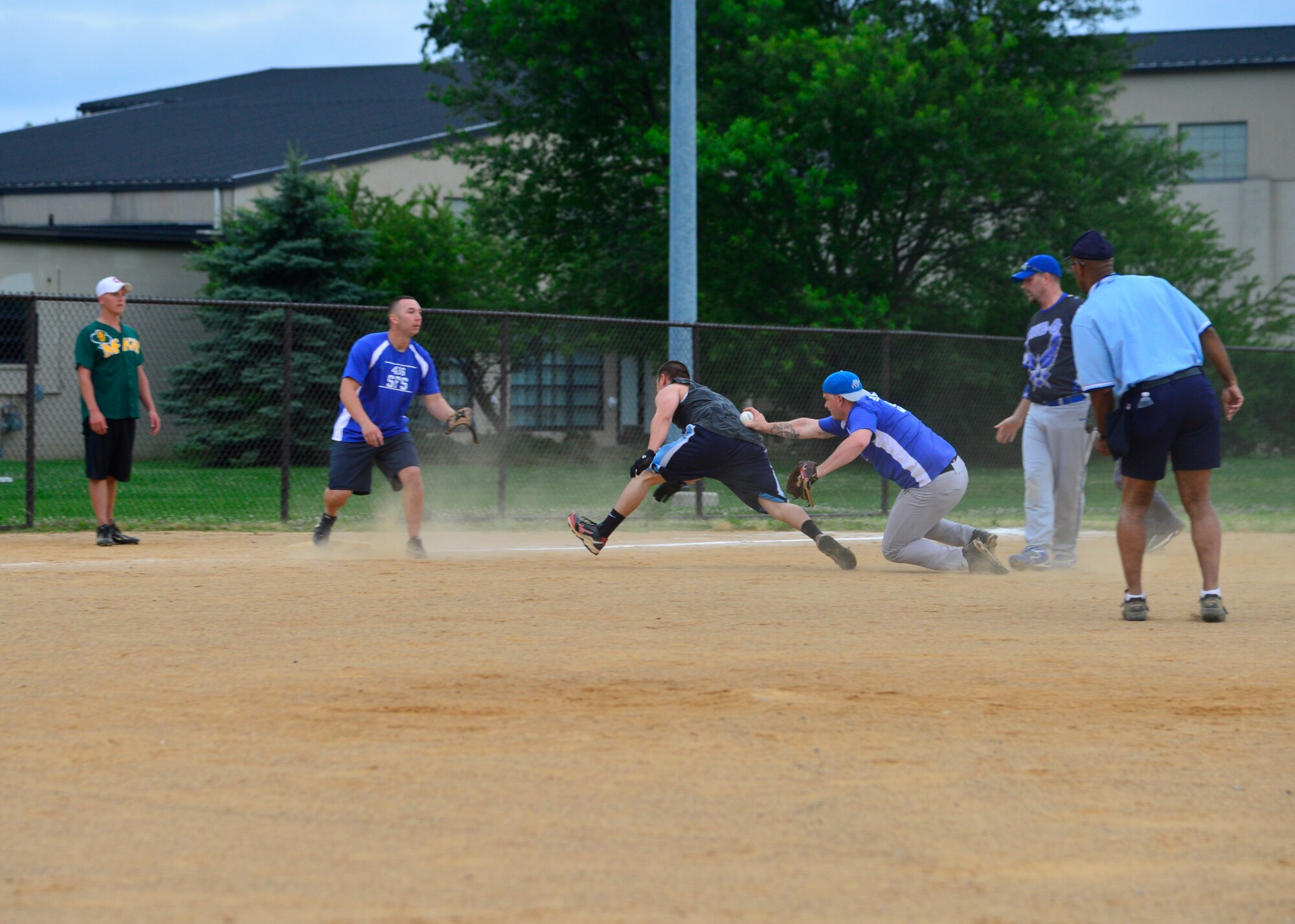 John Broughal, 436th Security Forces Squadron, tags out Adrian Perez, 373d Training Squadron, in an intramural softball game June 17, 2015, at the softball field on Dover Air Force Base, Del. The 373d TRS defeated the 436th SFS, 11-6. (U.S. Air Force photo/Airman 1st Class William Johnson)