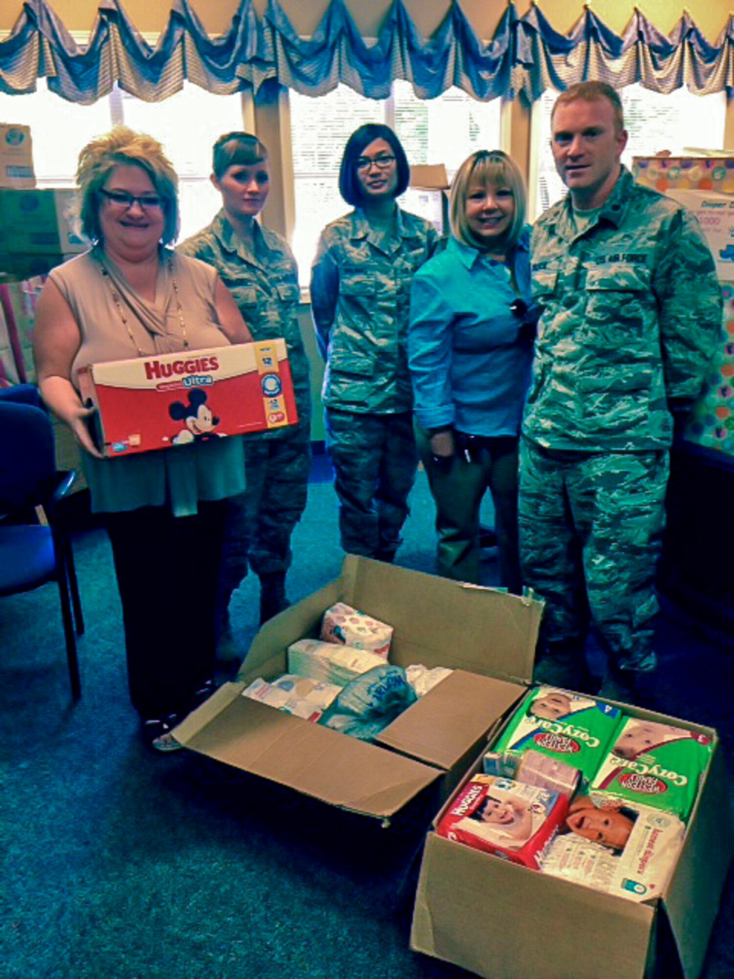 Members from the 92nd Medical Group pose for a photo after delivering nearly 1,500 diapers, formula, and other supplies to the Vanessa Behan Crisis Nursery June 17, 2015, in Spokane, Wash. The annual diaper drive was part of National Child Abuse Prevention Month. The Vanessa Behan Crisis Nursery provides a haven of unconditional love and attention from adults whose only hope is to create lifetime memories of security. The Airmen volunteers exceeded the program’s goal and doubled the number of diapers and supplies donated last year. (Courtesy photo)