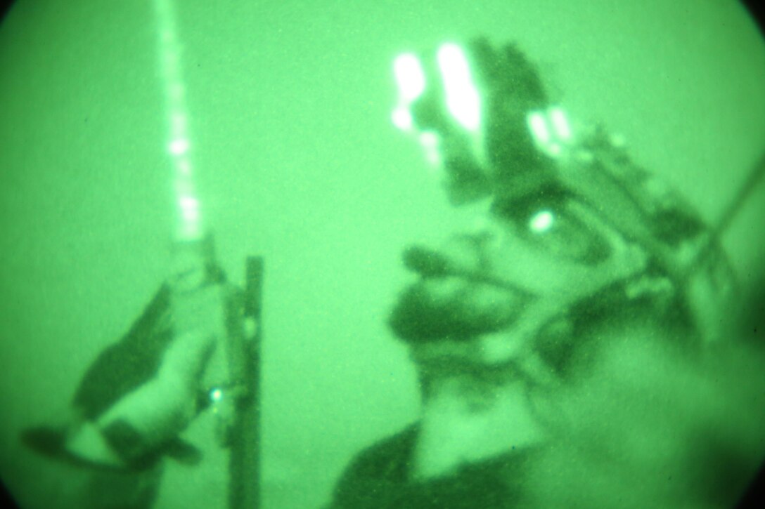 A combat controller, deployed with a U.S. Army Special Forces team in Afghanistan, communicates with overhead aircraft before calling in airstrikes during an engagement with insurgents. A Special Tactics combat controller integrates air power into ground special operations for mission success, deploying into forward hostile areas to control offensive airstrike operations (also known as Joint Terminal Attack Control), as well as establish assault zones and provide air traffic control capability. (U.S. Air Force photo/Released)