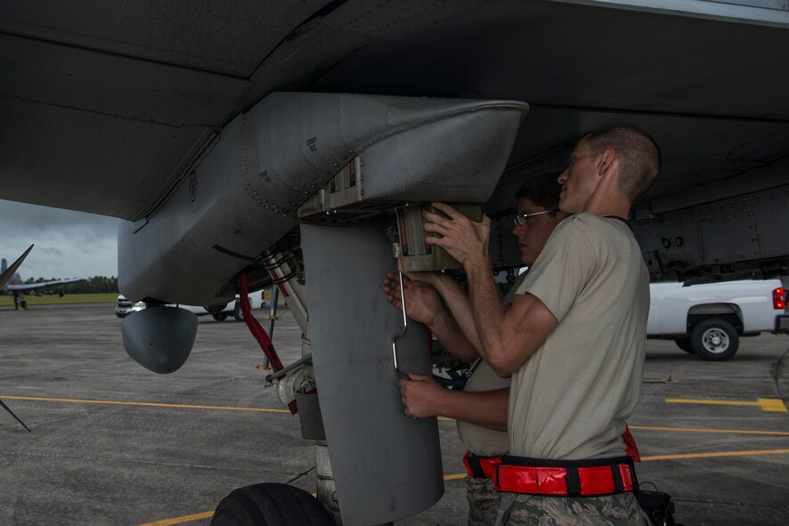 U.S. Air Force Staff Sgt. Daniel Butzin, right, 75th Aircraft Maintenance Unit weapons load crew chief, and Airman 1st Class Keegan Gibson, 75th AMU weapons load crew member, replace a flare magazine on an A-10C Thunderbolt II machine gun during Exercise DRAGON STRIKE June 10, 2015, at Avon Park Air Force Range, Fla. The 23d Aircraft Maintenance Squadron maintained ten of Moody’s A-10s out of the 75th Fighter Squadron during the exercise. (U.S. Air Force photo by Airman 1st Class Dillian Bamman/Released)