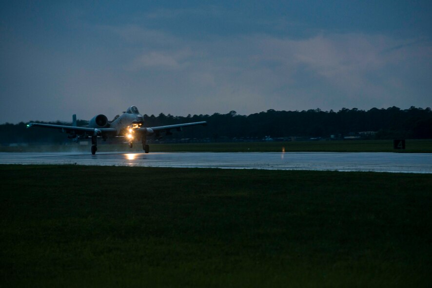 An A-10C Thunderbolt II takes off to perform a strafe run during Exercise DRAGON STRIKE June 9, 2015, at Avon Park Air Force Range, Fla. The A-10 pilot performs a strafe run by flying over a location and attacking targets with 50-caliber rounds. (U.S. Air Force photo by Airman 1st Class Dillian Bamman/Released)