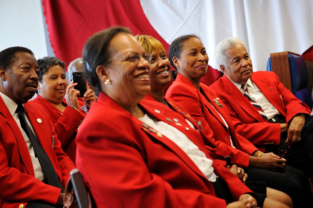 Tuskegee Airmen Inc. Tidewater Chapter members attend a Tuskegee Airmen Mural unveiling at the Exchange at Langley Air Force Base, Va., June 18, 2015. The Tuskegee Airmen include former pilots, navigators, bombardiers, maintainers, support staff and instructors. (U.S. Air Force photo by Senior Airman Breonna Veal/Released)