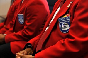 Tuskegee Airmen Inc. Tidewater Chapter members sit during the Tuskegee Airmen Mural unveiling at the Exchange at Langley Air Force Base, Va., June 18, 2015. Of the 56 Tuskegee Airmen chapters in the United States, there are 209 Airmen documented as original members. (U.S. Air Force photo by Senior Airman Breonna Veal/Released)