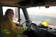 Mr. David Sunde, 9th Civil Engineer Squadron driver operator, drives a fire truck alongside a controlled burn at Beale Air Force Base, California on June 17, 2015. The burn consumed approximately 800 acres in an effort to renew cattle grazing land and control vegetation growth. (U.S. Air Force photo by Preston L. Cherry)