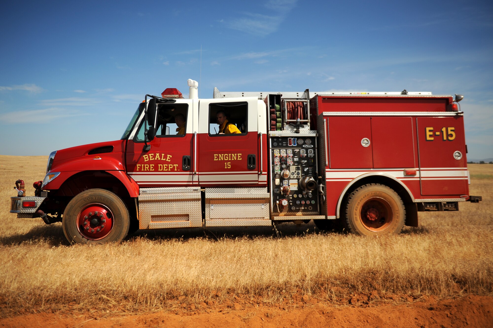 A Beale fire truck is positioned before a controlled burn is ignited June 17, 2015 at Beale Air Force Base, California. The burn consumed approximately 800 acres in an effort to renew cattle grazing land and control vegetation growth. (U.S. Air Force photo by Preston L. Cherry)