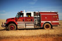 A Beale fire truck is positioned before a controlled burn is ignited June 17, 2015 at Beale Air Force Base, California. The burn consumed approximately 800 acres in an effort to renew cattle grazing land and control vegetation growth. (U.S. Air Force photo by Preston L. Cherry)