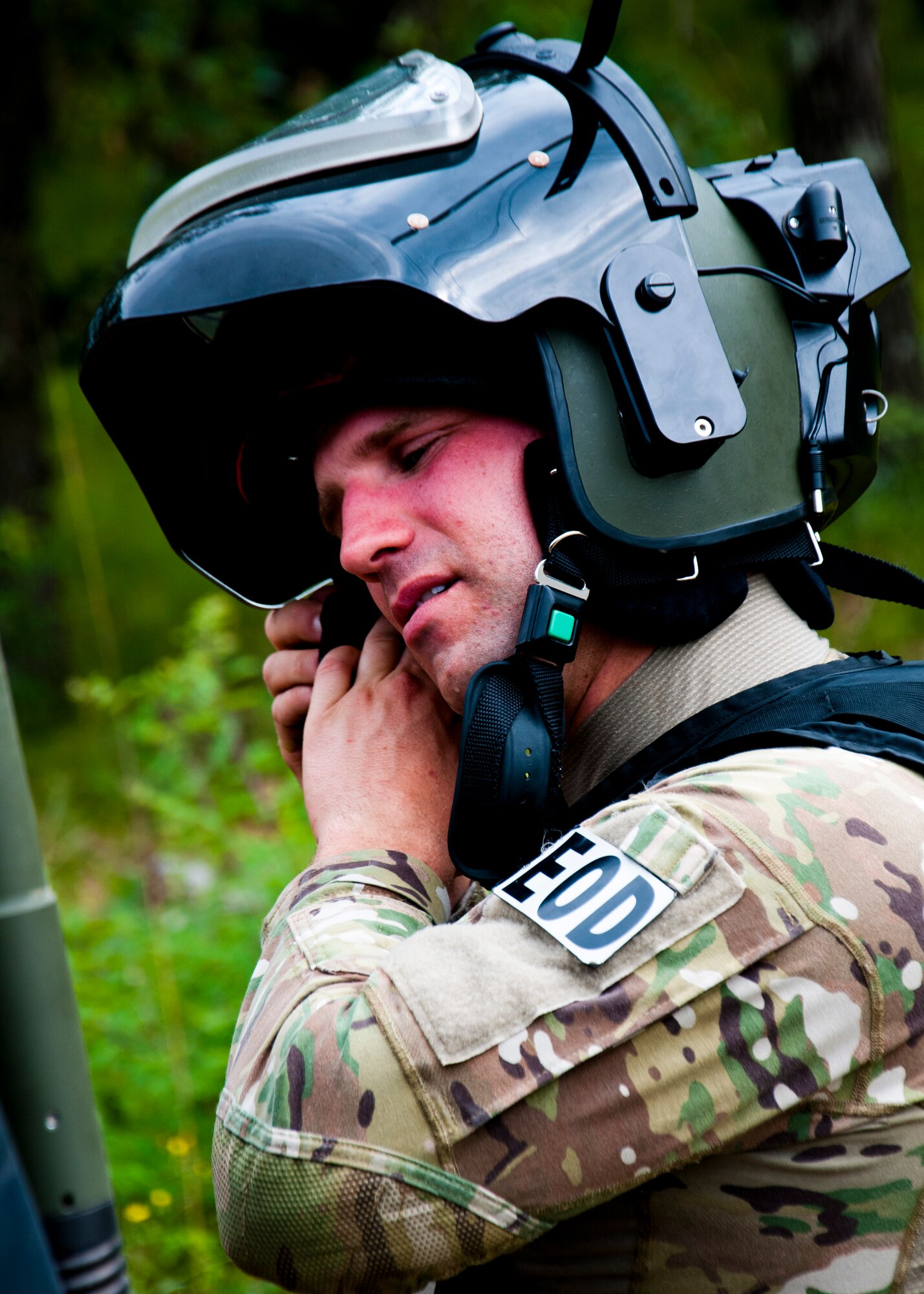 MSgt. Shawn Lundgren, 446th Civil Engineer Squadron explosive ordnance disposal technician gets into a bomb suit to remove a simulated improvised explosive device during the Patriot Warrior exercise at Fort McCoy, Wis., June 21, 2015. Patriot Warrior is a joint exercise designed to demonstrate contingency deployment training ranging from bare base buildup to full operational capabilities. It supports Exercise Global Lightning, a Combat Support Training Exercise (CSTX) including Global Medic 15 and Quartermaster Liquid Logistics Exercise 15 (QLLEX). Over 6,000 members from U.S. service components including Air Force, Army, and Navy (Active, Guard, and Reserve) participated alongside British and Canadian forces. (U.S. Air Force photo by Senior Airman Daniel Liddicoet/Released)