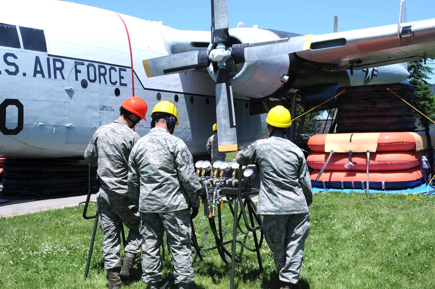 Personnel from the 914th Maintenance Squadron, Crash Damaged and Disabled Aircraft Recover Team monitor air pressure for pneumatic airbags, during an exercise, at the Niagara Falls Air Reserve Station on June 6, 2015. Green led a team of more than 20 personnel through a simulated crash and recovery exercise. (U.S. Air Force photo by Staff Sgt. Matthew Burke)