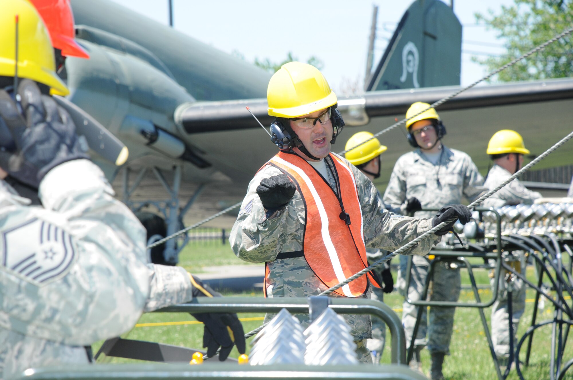 Tech. Sgt. Norman Green, 914th Maintenance Squadron, Crash Damaged and Disabled Aircraft Recover Team Chief, verifies air pressure with members of the CDDAR team at Niagara Falls Air Reserve Station on June 6, 2015. Green led a team of more than 20 personnel through a simulated crash and recovery exercise. (U.S. Air Force photo by Staff Sgt. Matthew Burke)