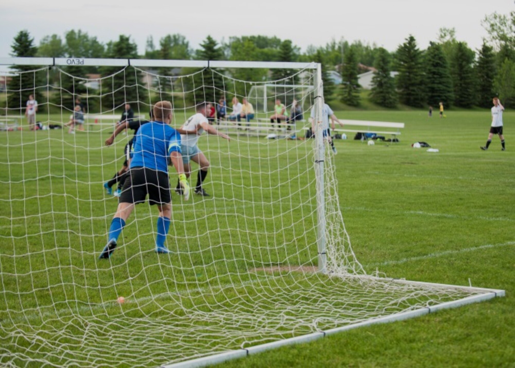 Senior Airman Ryan Praleikas, an aerospace medical technician with the 5th Medical Group, prepares to stop a corner kick from the opposing team at Optimist Soccer Compex, Minot, N.D., June 17, 2015. Praleikas said he started playing goal keeper at a young age and eventually went on to play the same position for the Air Force Men’s Soccer team. (U.S. Air Force photo/Airman 1st Class Christian Sullivan)