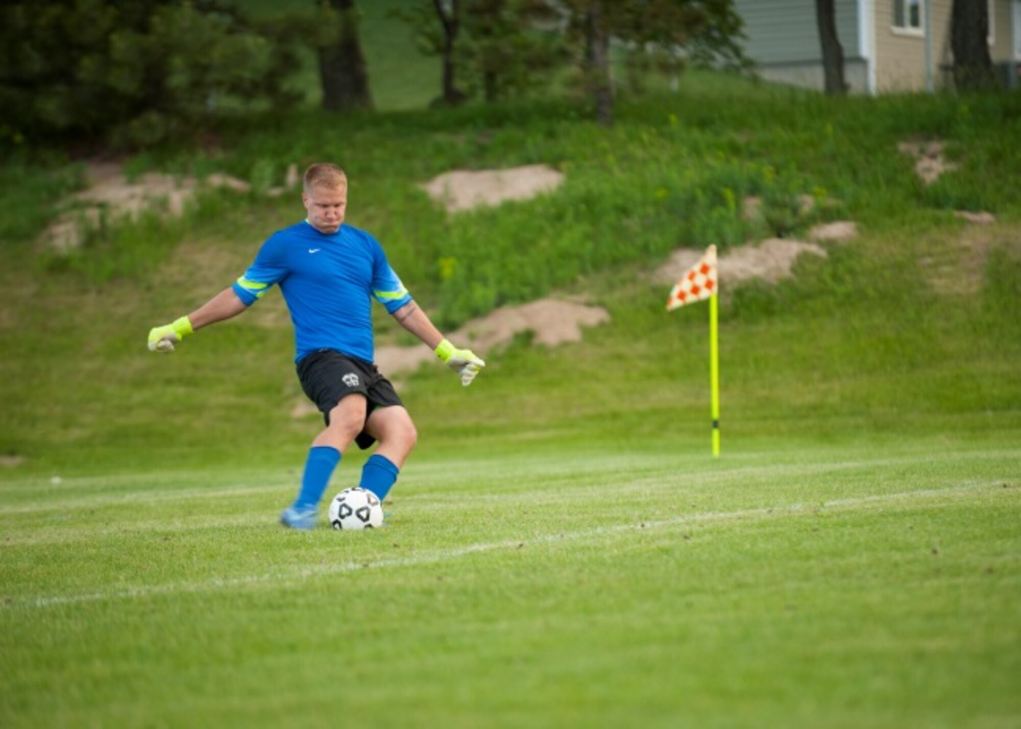 Senior Airman Ryan Praleikas, an aerospace medical technician with the 5th Medical Group, strikes the ball back to his teammates after a failed score attempt from the opposing team at Optimist Soccer Complex, Minot, N.D., June 17, 2015. Praleikas was on the 2015 U.S. Air Force Men’s Soccer team when they took home silver in the All Armed Forces Tournament. (U.S. Air Force photo/Airman 1st Class Christian Sullivan)