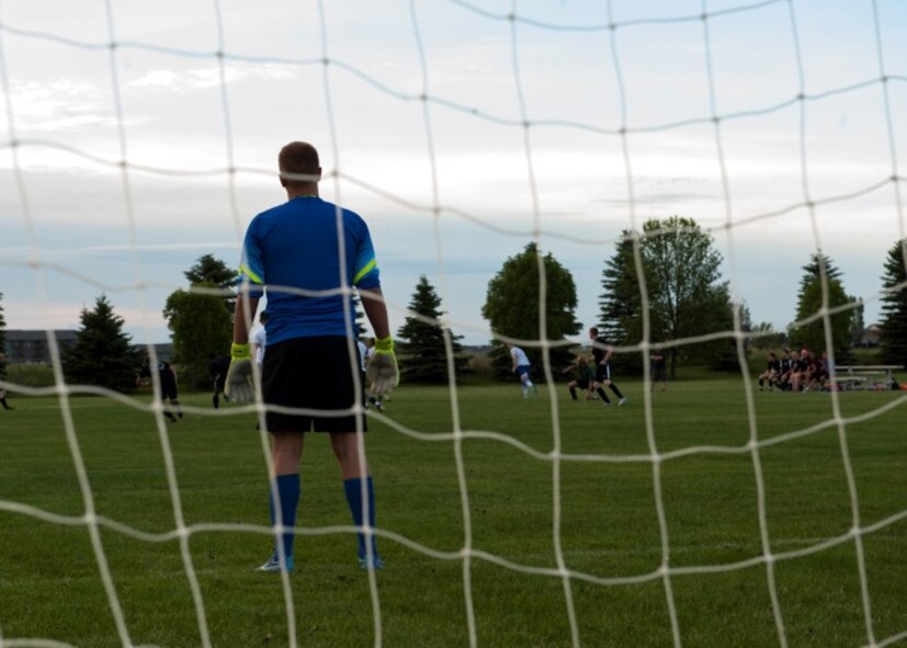 Senior Airman Ryan Praleikas, an aerospace medical technician with the 5th Medical Group, looks on as his team runs down the field to try and score at the Optimist Soccer Complex, Minot , N.D., June 17, 2015. Praleikas recently made the U.S. Air Force Men’s Soccer team. (U.S. Air Force photo/Airman 1st Class Christian Sullivan)
