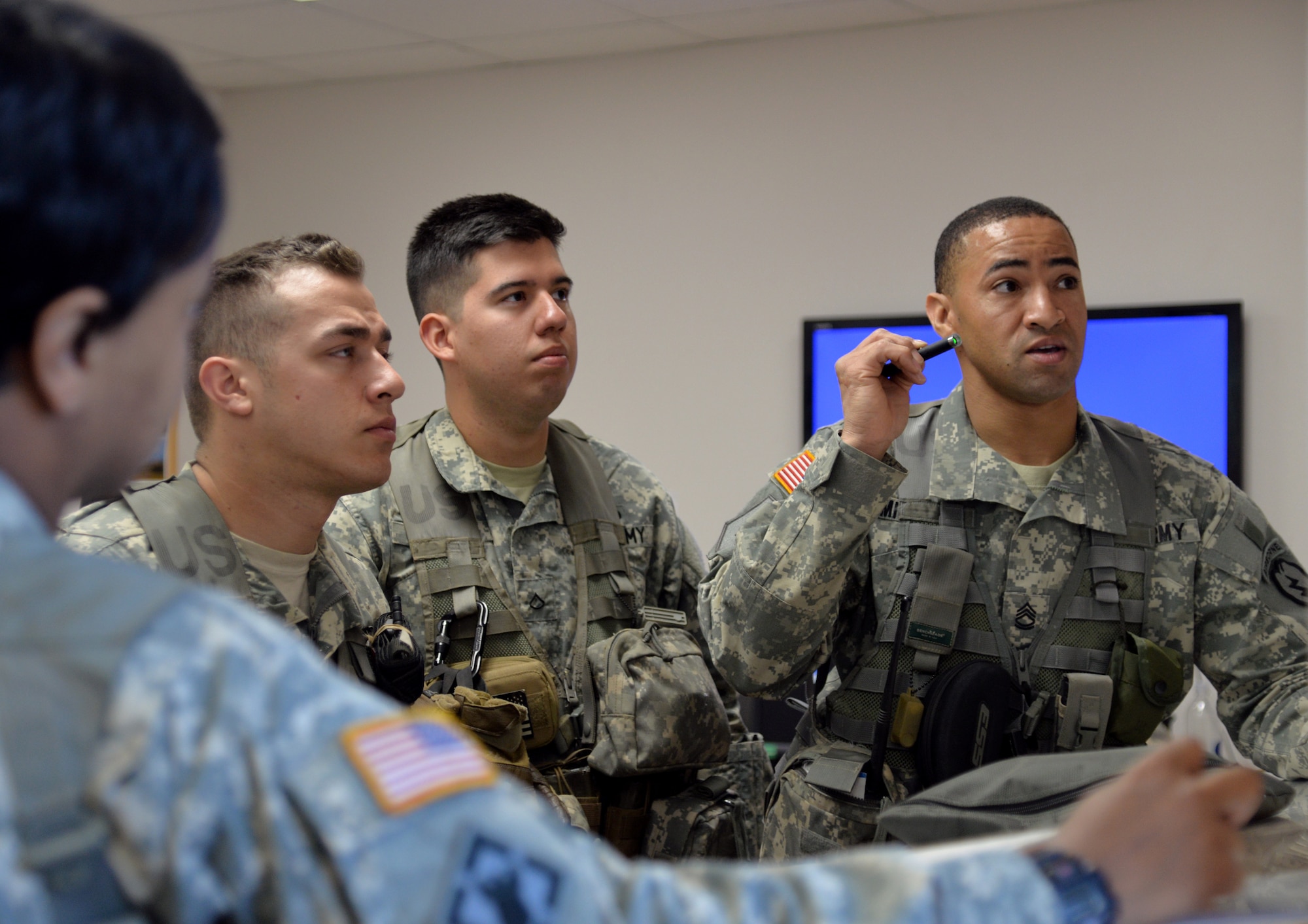 U.S. Army Sgt. 1st Class Duriel Mitchem, the medical section NCOIC with the 6th Brigade Engineer Battalion, 4th Brigade Combat Team (Airborne), 25th Infantry Division, discusses staging locations for the medical team in a drop zone at Allen Army Airfield on Fort Greely, Alaska, where they can quickly respond to any potential injuries after combat engineers parachute into area for an airfield seizure scenario as part of Exercise Northern Edge, June 17, 2015. Northern Edge 2015 is Alaska's premier joint training exercise designed to practice operations, techniques and procedures as well as enhance interoperability among the services. Thousands of Airmen, Soldiers, Sailors, Marines and Coast Guardsmen from active duty, reserve and National Guard units are involved. (U.S. Air Force photo by Master Sgt. Karen J. Tomasik/Released)
