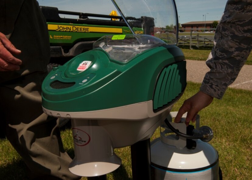 Lester Nicholas, pest management foreman, and Tech Sgt Seung Paeng, noncommissioned officer in charge of Pest Management, check the “mosquito magnet” at Minot Air Force Base, N.D., June 18, 2015. Pest Management works to protect the health and morale of base personnel through a comprehensive mosquito control program. (U.S. Air Force photo/Airman 1st Class Christian Sullivan)