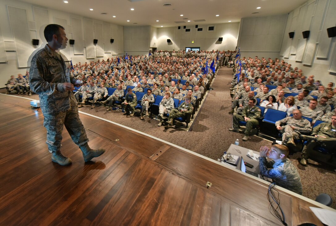The entire 932nd Airlift Wing came together during the June Unit Training Assembly to attend the commander's call special event in the theater, featuring awards, safety briefings and interaction with the "boss".  Colonel Karl Goerke (on stage) is the commander, 932nd Airlift Wing, Scott Air Force Base, Illinois. He took many various questions and provided answers immediately to the unit Airmen to ensure communication is ongoing and understandable.  Throughout the year, the commander ensures the wing executes its mission of providing mission-ready, citizen airmen supporting national interests worldwide through Distinguished Visitor (DV) airlift, expeditionary combat support, and ground/aeromedical care.  (U.S. Air Force photo/Tech. Sgt. Christopher Parr)