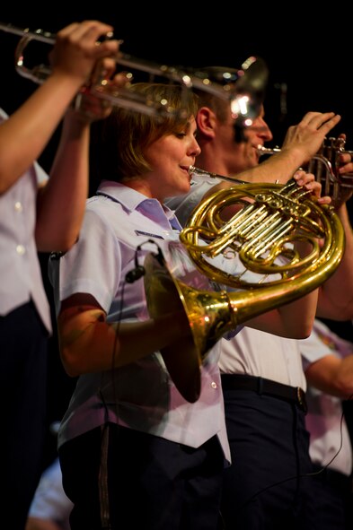 Senior Airman Alena Zidlicky, performs with the brass section of U.S. Air Force Heartland of America Band Vortex, at Nelson Hall auditorium at Minot State University, Minot, N.D., June 16, 2015.  In addition to the concert at MSU, the band also offered free concerts in surrounding communities to thank community members throughout the missile complex for their support of the mission at Minot Air Force Base.  (U.S. Air Force photo/Airman 1st Class Justin T. Armstrong)