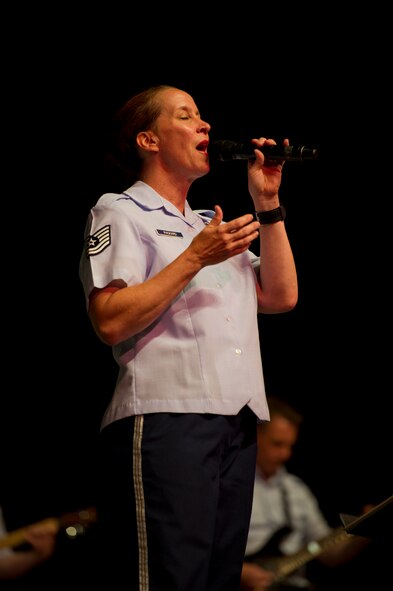 Tech Sgt. Becky Packard, vocalist for U.S. Air Force Heartland of America Band Vortex, performs at Nelson Hall Auditorium at Minot State University, Minot, N.D., June 16, 2015. The performance concluded with a rendition of “God Bless America” sung by Packard. (U.S. Air Force photo/Airman 1st Class Justin T. Armstrong)