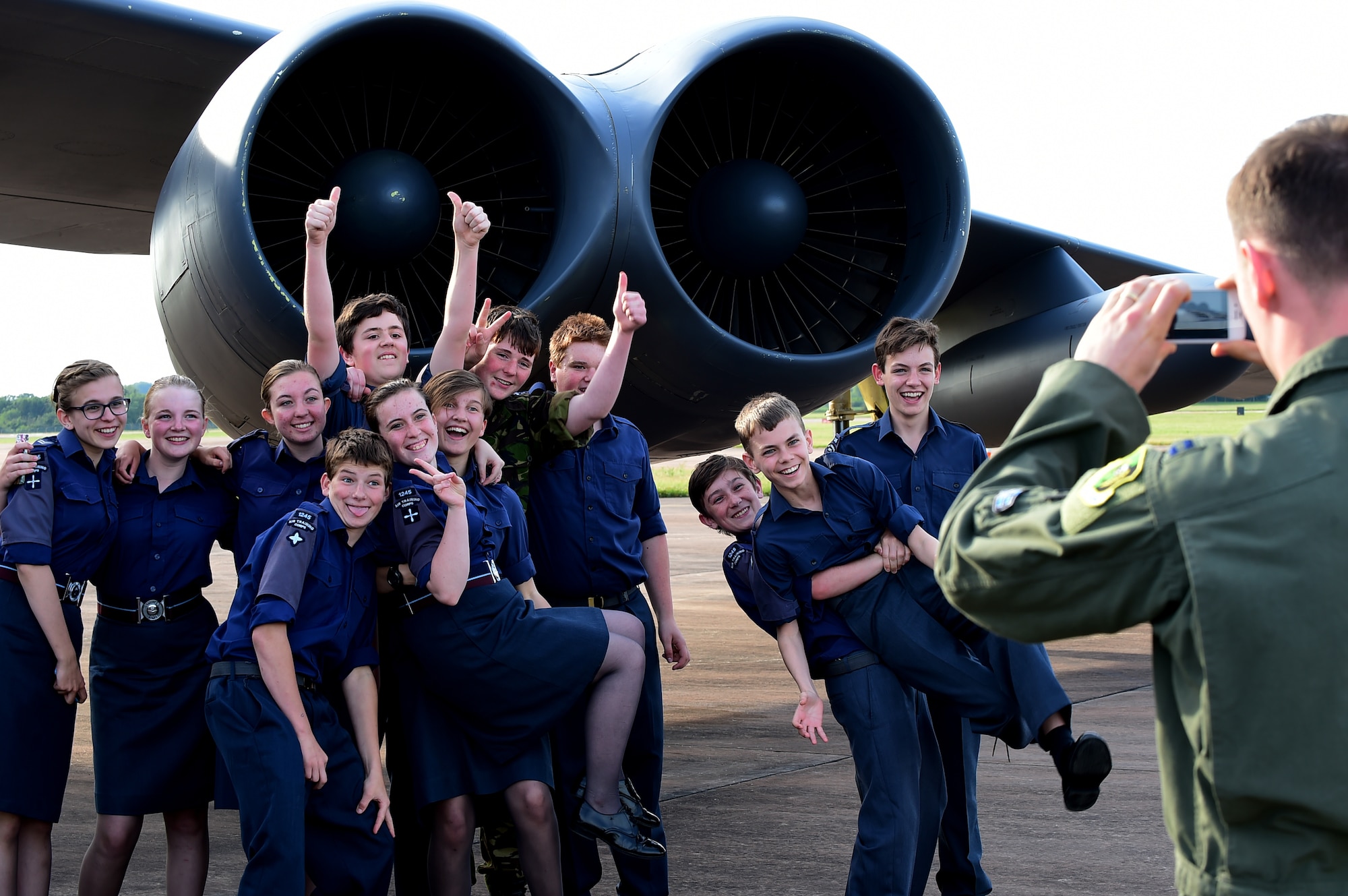 British Air Cadets from 614 and 1245 Air Training Squadrons, pose for a group photo taken by a B-52H crew member during their tour of a B-52H Stratofortress at RAF Fairford, United Kingdom, June 16, 2015. The Air Cadets had the opportunity to see the B-52H up close and ask the crew questions. The B-52H is forward-deployed to RAF Fairford in support of the BALTOPS 15 and SABER STRIKE 15 exercises. (U.S. Air Force photo by Tech. Sgt. Chrissy Best)