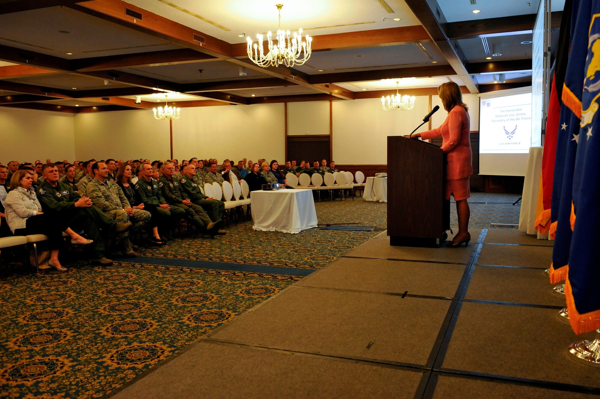 U.S. Secretary of the Air Force Deborah Lee James speaks to U.S. Air Forces in Europe and Air Forces Africa personnel during an all call June 19, 2015, at Ramstein Air Base, Germany. The SECAF attended the all call during her brief stop at Ramstein and addressed the crowd on current topics in the Air Force and answered questions from the audience. (U.S. Air Force photo/Staff Sgt. Leslie Keopka)