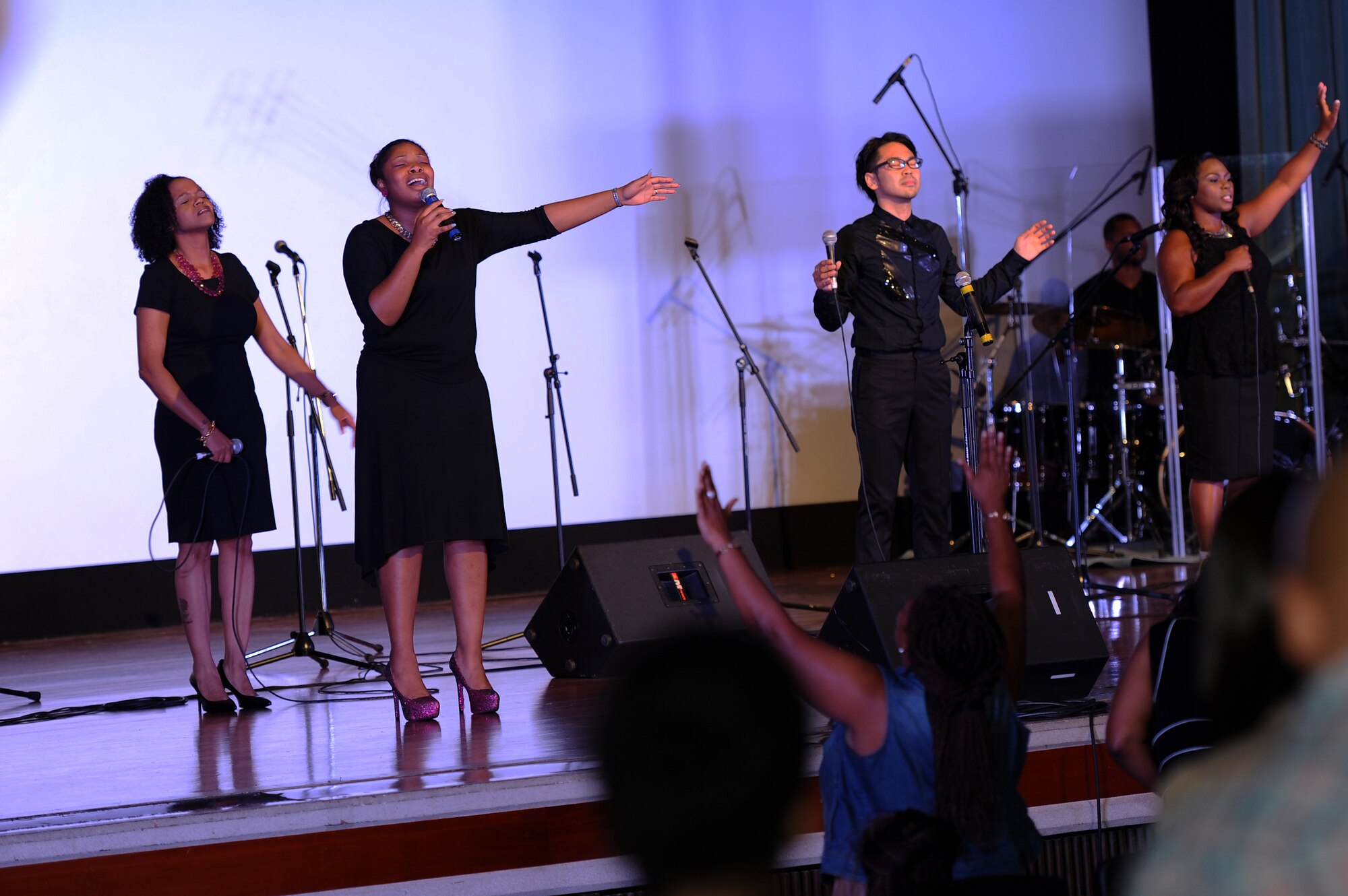 American and Japanese singers perform during a gospel music event at the Keystone Theater on Kadena Air Base, Japan, June 20, 2015. Several American and Japanese singers performed ahead of the event’s headliner, Grammy-nominated gospel singer Vanessa Bell Armstrong. The event was aimed at promoting spiritual wellness and resiliency among Airmen and their families while strengthening ties with the local community. (U.S. Air Force photo by Airman 1st Class Zade C. Vadnais) 