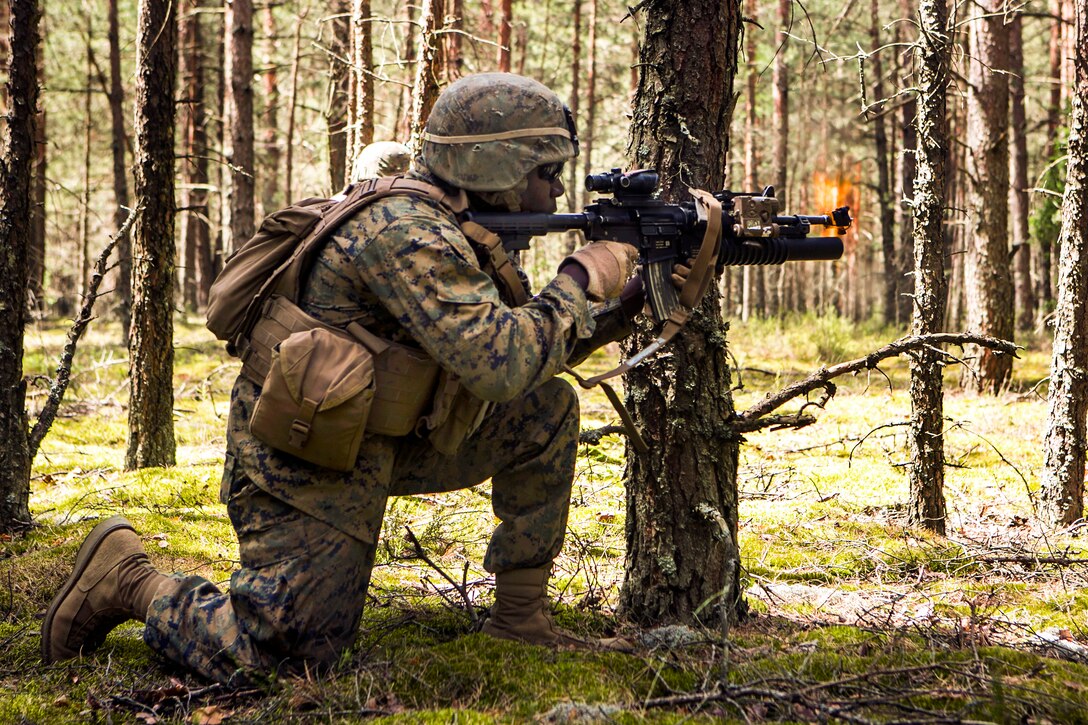 A U.S. Marine fires his weapon during Exercise Saber Strike at the ...