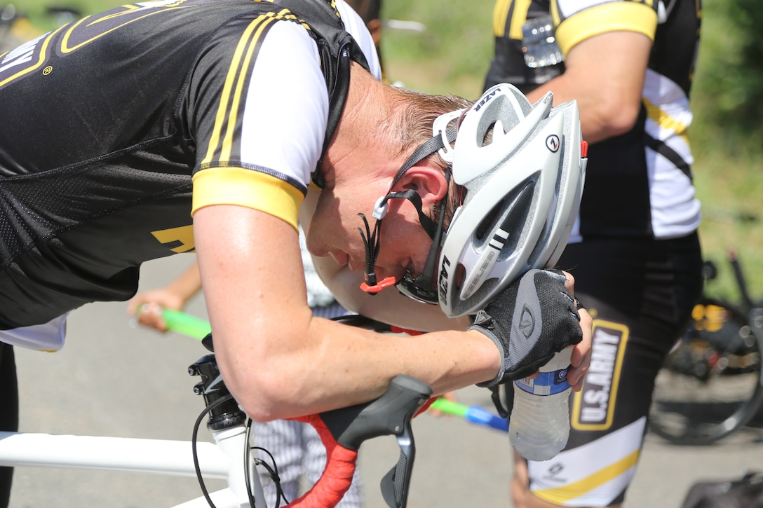 Tandem pilot Richard Kirby takes a minute to catch his breath at the end of his tandem cycling competition at the 2015 Department of Defense Warrior Games on Marine Corps Base Quantico, Va., June 21, 2015. 