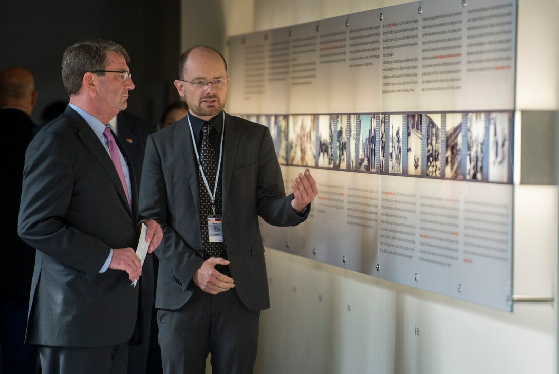 Dr. Ulrich Baumann, deputy director of the Memorial to the Murdered Jews of Europe, Germany's Holocaust museum, gives U.S. Defense Secretary Ash Carter a tour of the facility in Berlin, June 22, 2015.