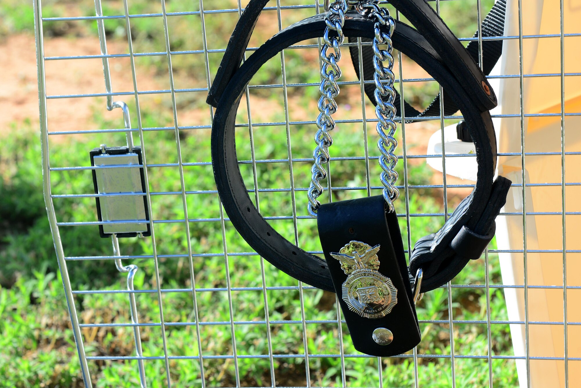 A military working dog badge and collar decorate a display dedicated to military working dog Baron June 17, 2015 at Cannon Air Force Base, N.M. Baron’s numerous achievements during his six years of active duty were remembered at a ceremony honoring his life and service. (U.S. Air Force photo/Airman 1st Class Shelby Kay-Fantozzi)