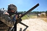 Pfc. Jeremy Westover of the Vermont Army National Guard fires his M-16 rifle
from a hedgehog beach obstacle during the combined arms match of the 2011
U.S. Army Small Arms Championship March 25 at Fort Benning, Ga. These
obstacles were made famous during the World War II D-Day invasion of
Normandy, France.