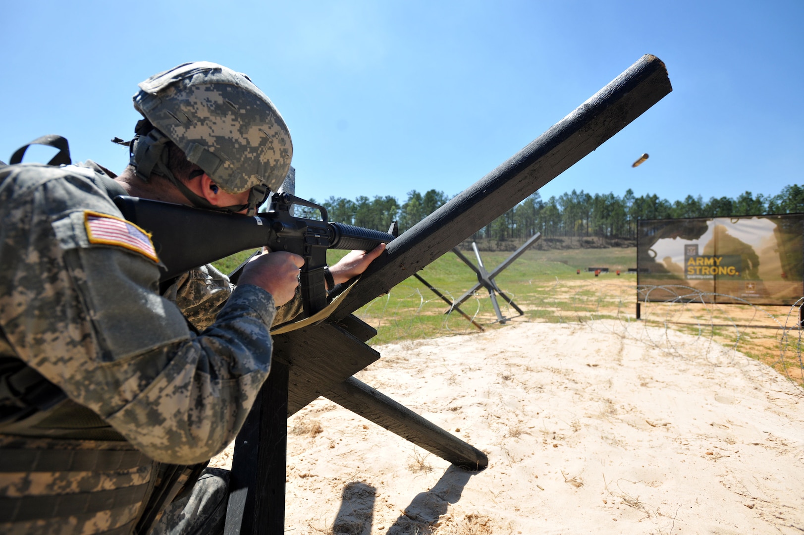 Pfc. Jeremy Westover of the Vermont Army National Guard fires his M-16 rifle
from a hedgehog beach obstacle during the combined arms match of the 2011
U.S. Army Small Arms Championship March 25 at Fort Benning, Ga. These
obstacles were made famous during the World War II D-Day invasion of
Normandy, France.