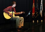 Keegan Neverett performs a song for the audience at the Our Military Kids of 
the Year awards ceremony at the Navy Memorial in Washington, D.C., April 14, 
2011. Neverett, whose father serves in the Army National Guard, was one of 
four children honored by Our Military Kids, a nonprofit organization that 
provides artistic, athletic and educational grants to children of deployed 
National Guardsmen and military Reservists.