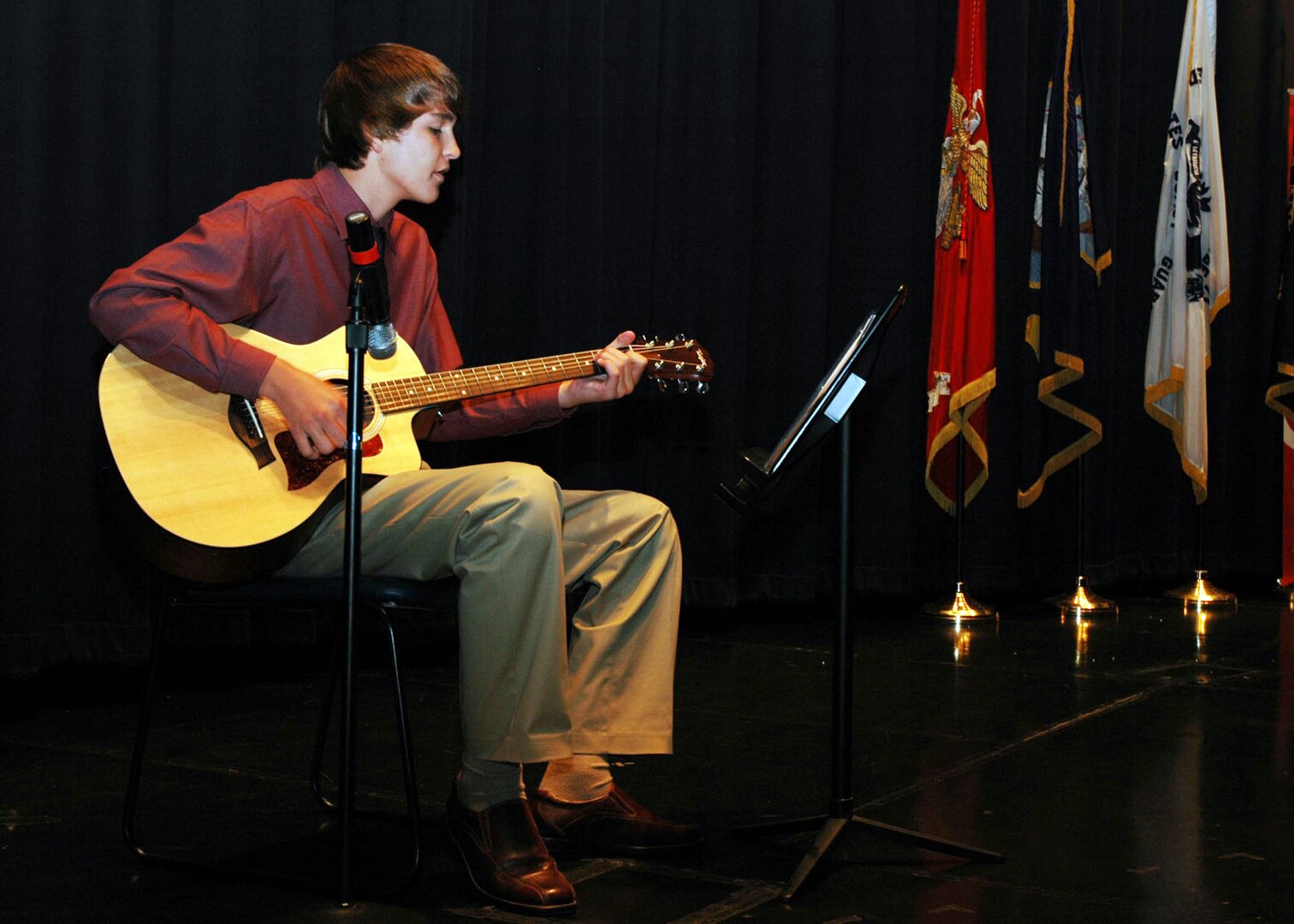 Keegan Neverett performs a song for the audience at the Our Military Kids of 
the Year awards ceremony at the Navy Memorial in Washington, D.C., April 14, 
2011. Neverett, whose father serves in the Army National Guard, was one of 
four children honored by Our Military Kids, a nonprofit organization that 
provides artistic, athletic and educational grants to children of deployed 
National Guardsmen and military Reservists.
