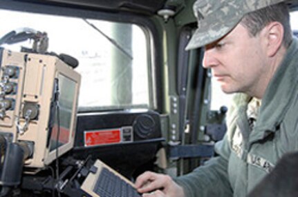 Army Sgt. Michael Bauder, assigned to the 231st Brigade Support Battalion, operates a Mobile Tracking System in a vehicle in Valley City, N.D., April 18, 2011. The MTS is capable of acting as a navigation system and uses maps to mark roads that have been blocked off and communicates this information with other vehicles. The MTS has only been used during training until now.