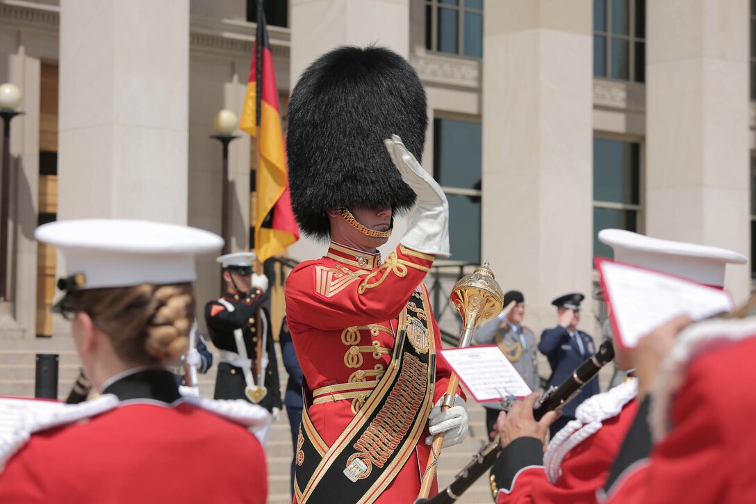 On June 23, 2015, Drum Major Master Sgt. Duane King led the Marine Band in an enhanced cordon ceremony at the Pentagon for Gen. Volker Wieker, the Chief of Defense for the German Armed Forces. (U.S. Marine Corps photo by Master Sgt. Kristin duBois/released.)