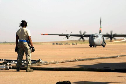 Air Force Staff Sgt. Anthony Hayes, 145th Aircraft Maintenance Squadron, 
North Carolina Air National Guard, prepares to refill a C-130H Hercules, 
equipped with the Modular Airborne Firefighting System, with fire retardant
as it taxis into the pits at Dyess Air Force Base, Texas, April 19, 2011. MAFFS
is capable of dispensing 3,000 gallons of water or fire retardant in under 5
seconds. Wildfires have spread across various parts of Texas and have burned
more than 1,000 square miles of land. 