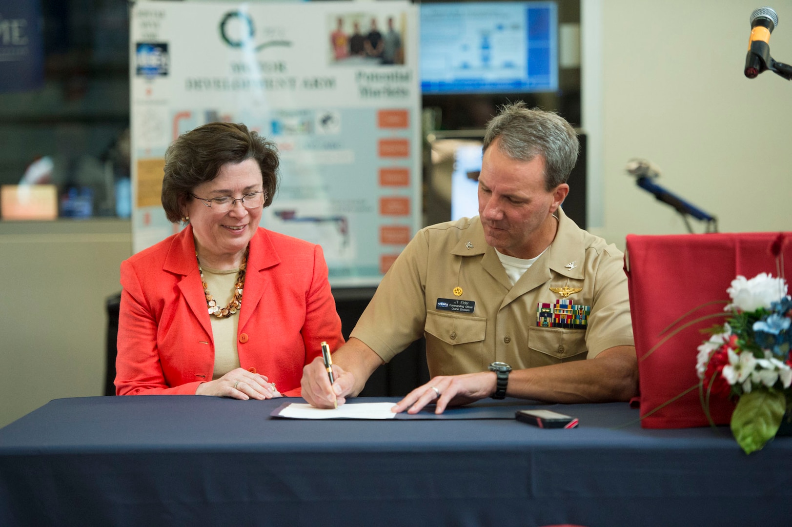 150622-N-BK152-001 - Naval Surface Warfare Center, Crane Division (NSWC Crane) and the University of Southern Indiana announced a renewed Partnership Intermediary Agreement (PIA) on Monday, June 22 during an event held on the USI campus. The event included representatives from both Crane and USI, including NSWC Crane Commanding Officer CAPT Jeffrey Elder and USI President Linda L. M. Bennett. (Photo credit - University of Southern Indiana)