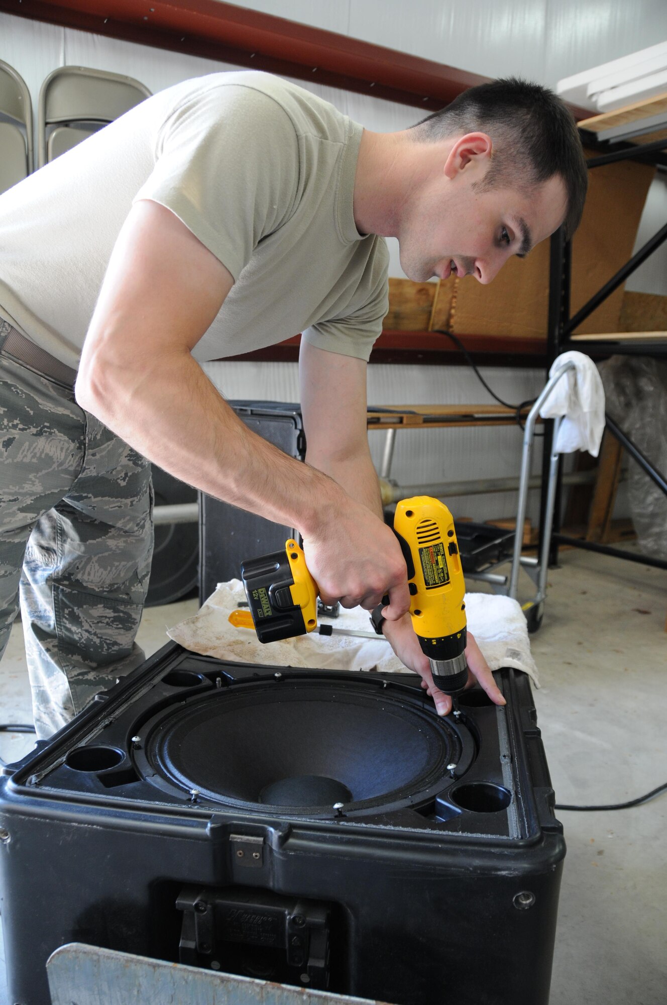 Staff Sgt. Michael Korosec, 910th Communications Squadron radio frequency technician, refurbishes the speakers in a public address kit here, June 7, 2015. These kits are mobile and can be used anywhere on the installation for events and ceremonies. (U.S. Air Force photo/Staff Sgt. Rachel Kocin)